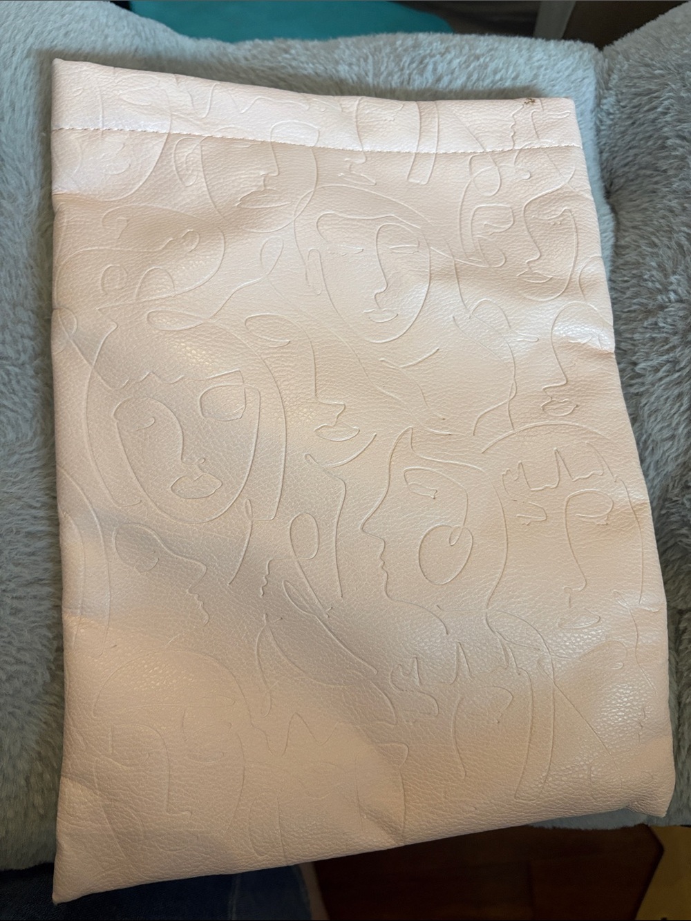 Cream Embossed Artistic Face Book Sleeve